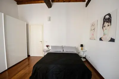 Letto o letti in una camera di PINK HOUSE TORTELLINOSUITE Modena