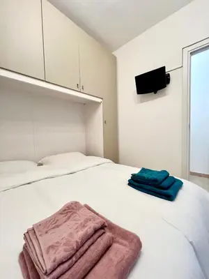 Letto o letti in una camera di Pavia in Charme - Intero Appartamento