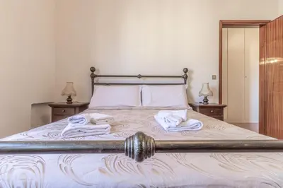 Letto o letti in una camera di Casa Pucci - Affitti Brevi Italia
