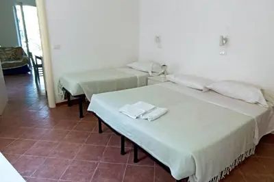 Letto o letti in una camera di Villa tranquilla immersa nel verde a 2 Km dal mare