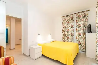 Letto o letti in una camera di Villa tranquilla immersa nel verde a 2 Km dal mare