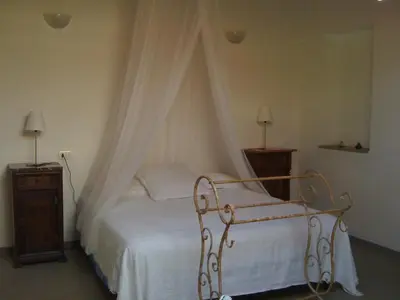 Letto o letti in una camera di Az. Agr. IL PARADISO di Beatrice Bondielli