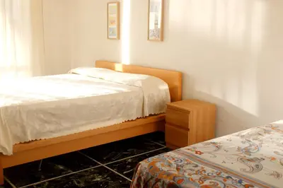 Letto o letti in una camera di Due Lune al Mare