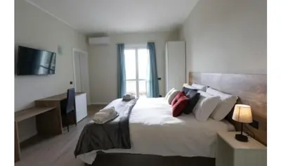 Letto o letti in una camera di B&B Residenza Alba Chiara