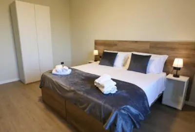 Letto o letti in una camera di B&B Residenza Alba Chiara