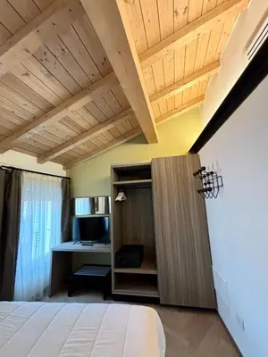 Letto o letti in una camera di Appartamenti Saragozza a due passi da Piazza Grande - WIFI e parcheggio gratuito