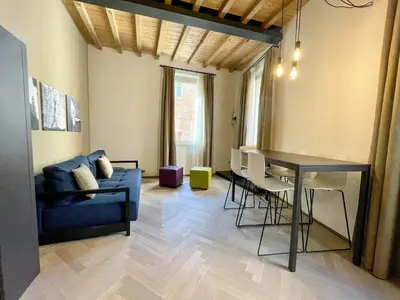 Area soggiorno di Appartamenti Saragozza a due passi da Piazza Grande - WIFI e parcheggio gratuito