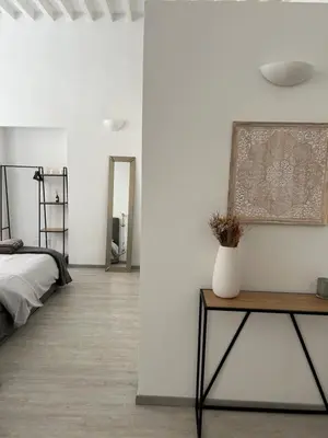 Letto o letti in una camera di Splendido Loft Centro Storico Parma
