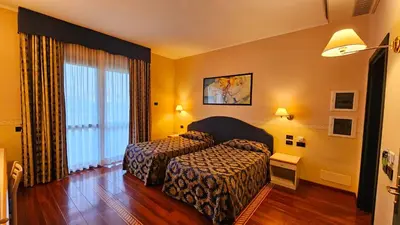 Letto o letti in una camera di HOTEL AI TIGLI