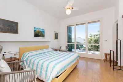 Letto o letti in una camera di Villa Nettuno- Bluchalet