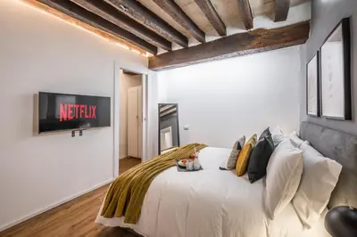 Letto o letti in una camera di Design in Centro a Modena, pass parcheggio incluso, Appartamento Ciao Bella