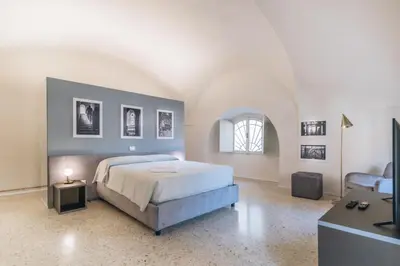 Letto o letti in una camera di Foresteria Il Voltone