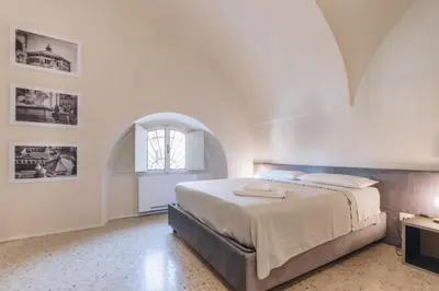 Letto o letti in una camera di Foresteria Il Voltone