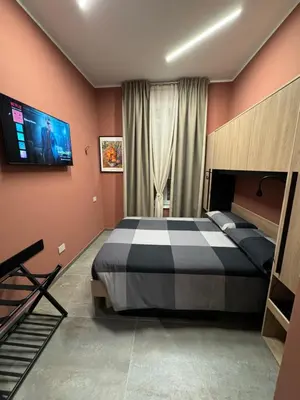 Letto o letti in una camera di B&B Parma Centro