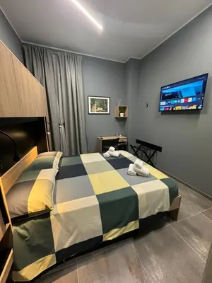 Letto o letti in una camera di B&B Parma Centro