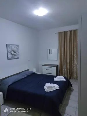 Letto o letti in una camera di Genysweethome