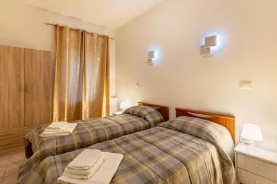 Letto o letti in una camera di Genysweethome