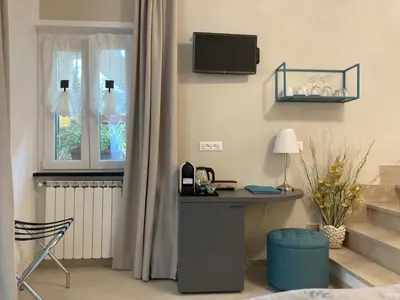 TV o dispositivi per l'intrattenimento presso Pae veciu camera privata con bagno
