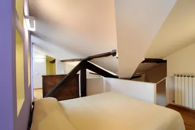 Letto o letti in una camera di SM Hospitality SANTO STEFANO