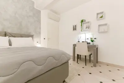 Letto o letti in una camera di Rismondo 89 - 90m Piazza Roma
