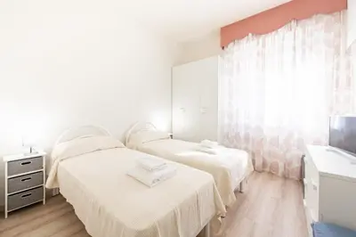 Letto o letti in una camera di GuestHost - Oltretorrente Ospedale Apartment