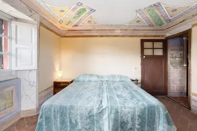 Letto o letti in una camera di AFFRESCATO - Palazzo Ravaschieri