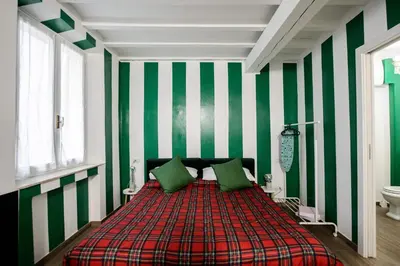 Letto o letti in una camera di PADDINGTON TORTELLINOSUITE Modena