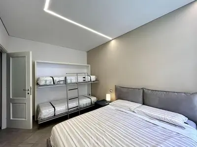 Letto o letti in una camera di Mare & Amore, Eleganza a due passi dal Mare
