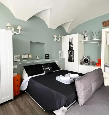 Letto o letti in una camera di COTTON CANDY TORTELLINOSUITE Modena