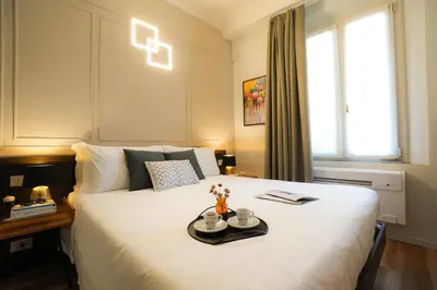 Letto o letti in una camera di Mazzini's Rooms