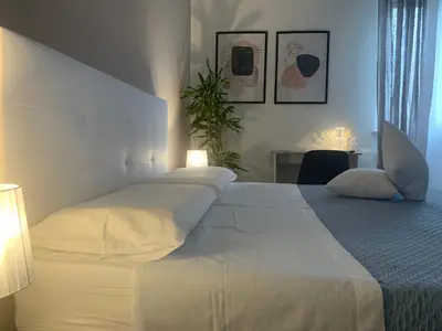 Letto o letti in una camera di b&b Calvino