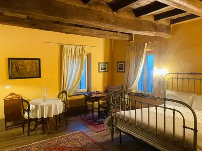 Letto o letti in una camera di BORGO VILLA VALENTINI