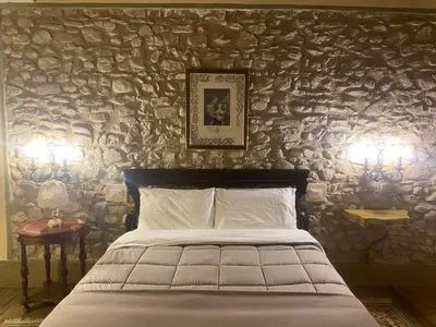 Letto o letti in una camera di BORGO VILLA VALENTINI