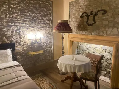 Letto o letti in una camera di BORGO VILLA VALENTINI