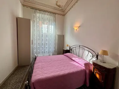 Letto o letti in una camera di Casa Liberty