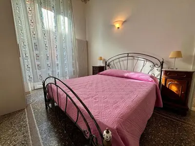 Letto o letti in una camera di Casa Liberty