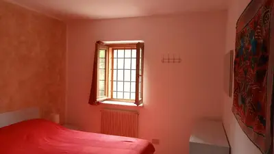 Letto o letti in una camera di La casa nel bosco, ma a 2 passi dal centro