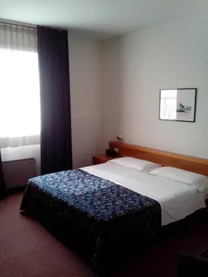 Letto o letti in una camera di Hotel Niki