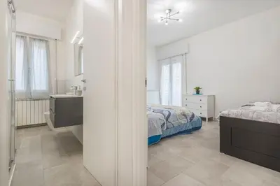 Letto o letti in una camera di Minimalist Oasis - City life & Hesperia Hospital