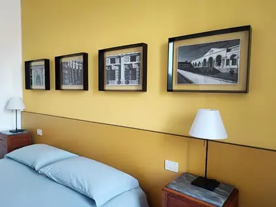 Letto o letti in una camera di Foresteria Juvarra