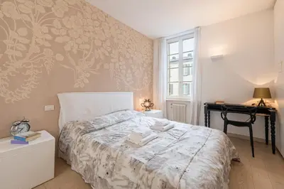 Letto o letti in una camera di GuestHost - Teatro Regio Exclusive Apartment