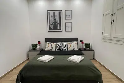 Letto o letti in una camera di The downtown loft Carpi Centro