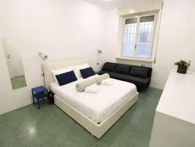 Letto o letti in una camera di Appartamento al Duomo di Parma - posto auto privato prenotabile