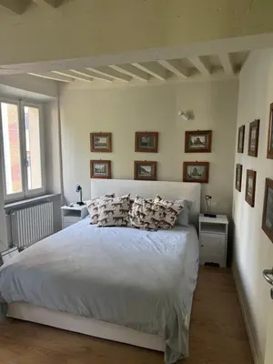 Letto o letti in una camera di Beautiful Center Apartments - posti auto privati prenotabili