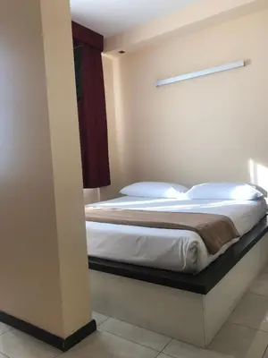 Letto o letti in una camera di ALBA HOTEL