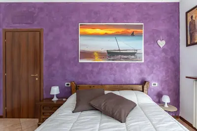 Letto o letti in una camera di Lilly House - Travacò Siccomario - by HOST4U