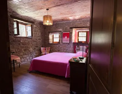 Letto o letti in una camera di Charming & Authentic Stone House La Brugna