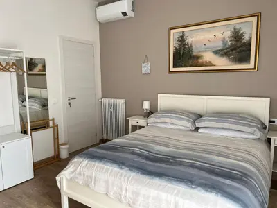 Letto o letti in una camera di Orchidea