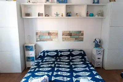 Letto o letti in una camera di Paradiso blu Riva Trigoso