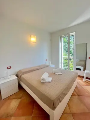 Letto o letti in una camera di Glicine Residenza Prealba con posto auto